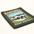 Embroidered patch with 'Bakewell Derbyshire Peak District' text and mountain design on a white background