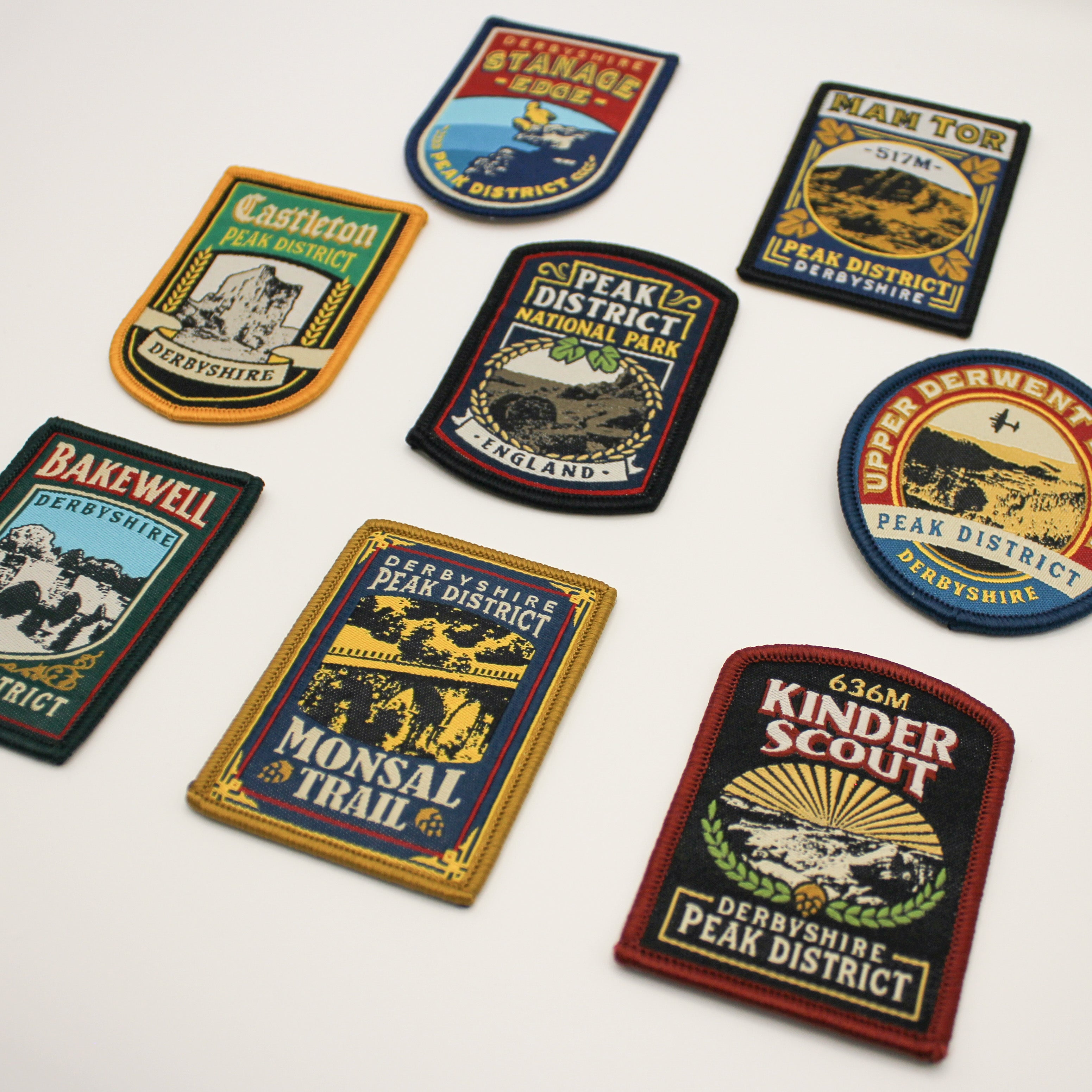 Collection of Peak District-themed patches on a white background